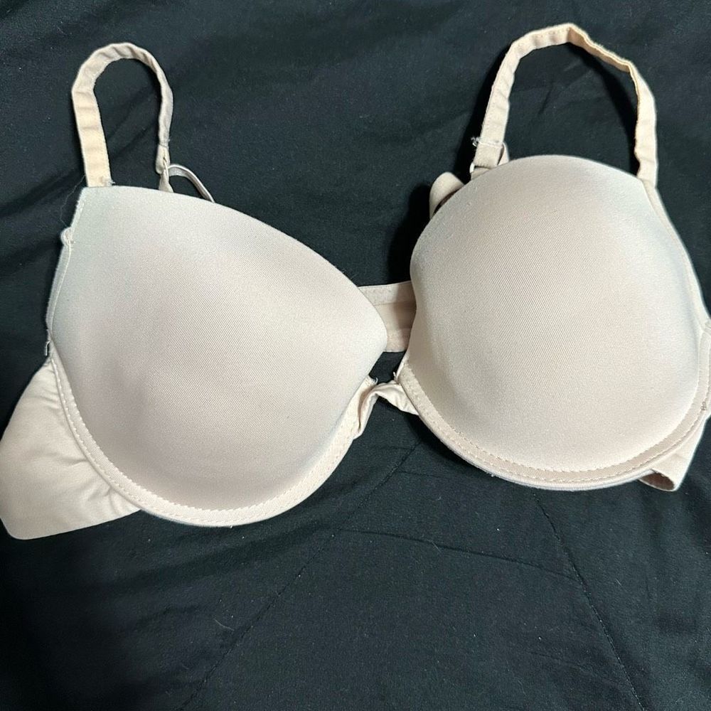 Tan underwire push up bra, neon pink polka dot inside
